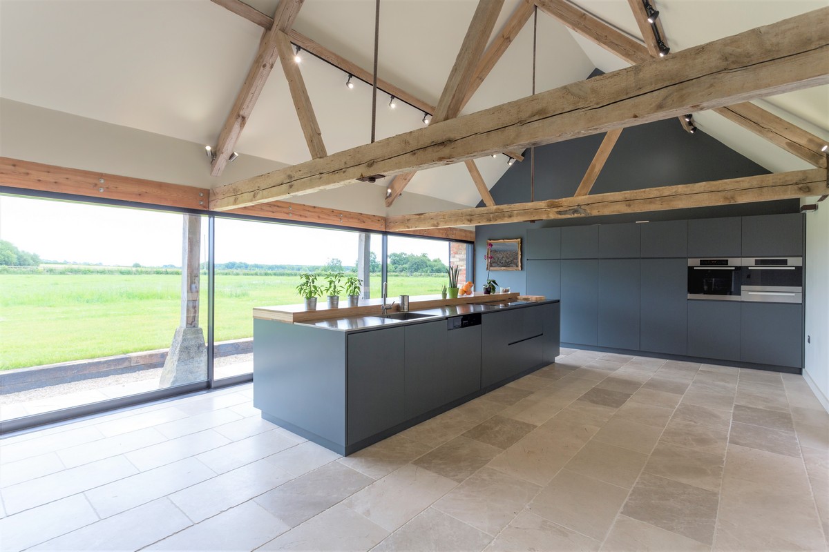 Breakfast bar and glass wall in modern kitchen